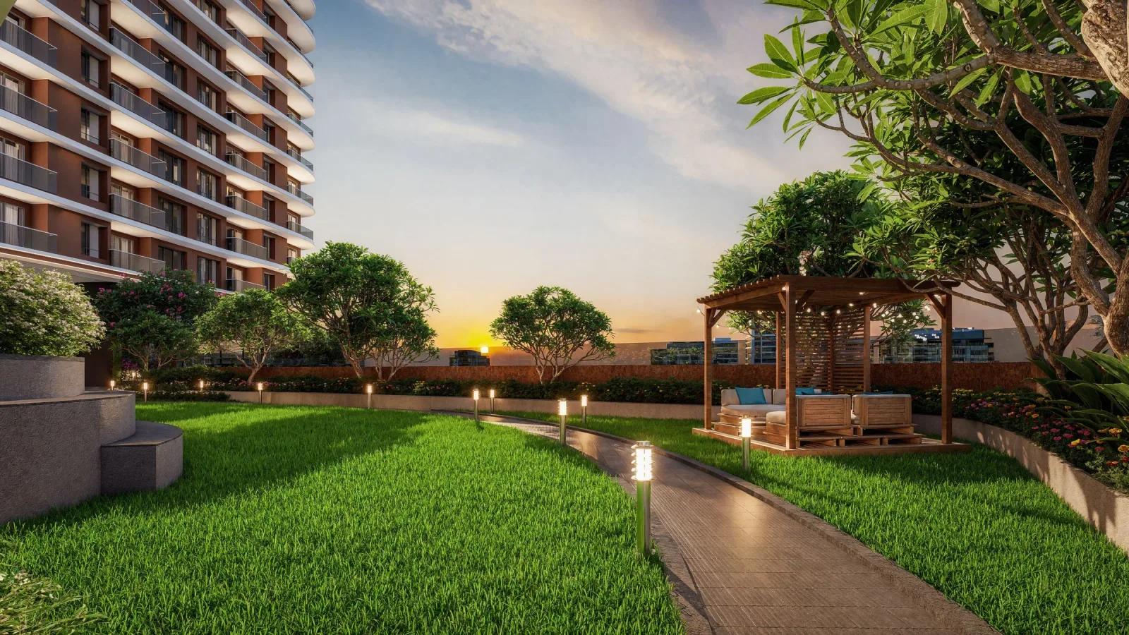 Podium lawn with pergola at Kohinoor Downtown, Wakad
