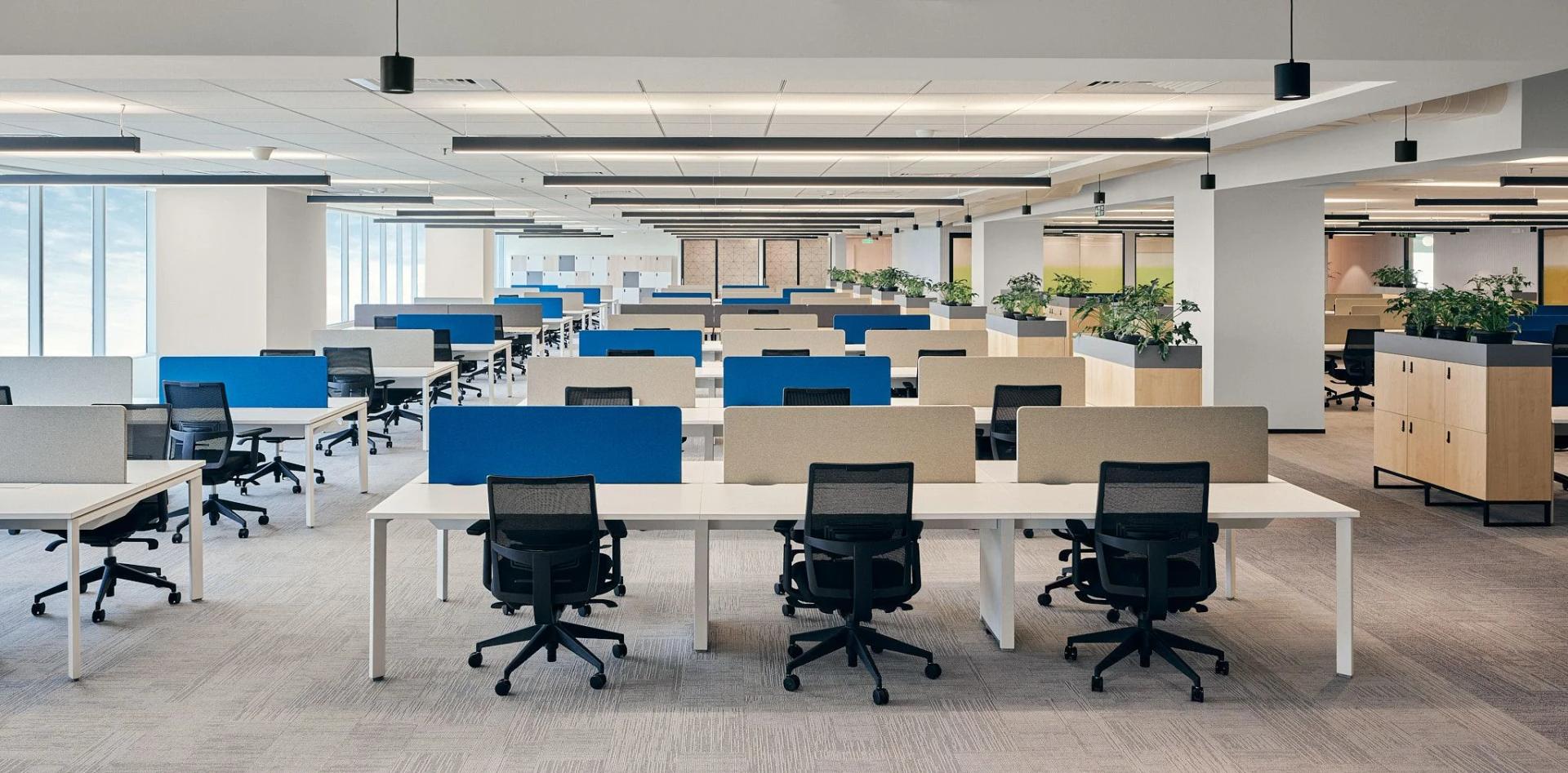 Open-plan office with blue-partition workstations at GT Pride Commercial, Ravet