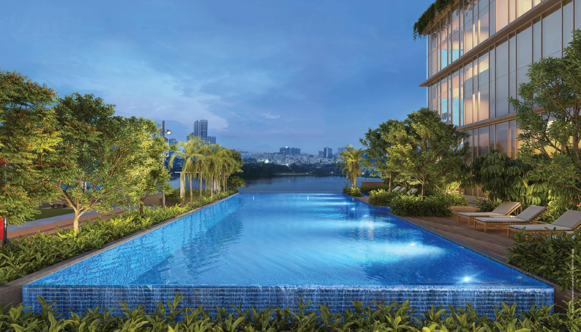 Infinity swimming pool overlooking the river at Godrej Aqua Vista, Keshav Nagar