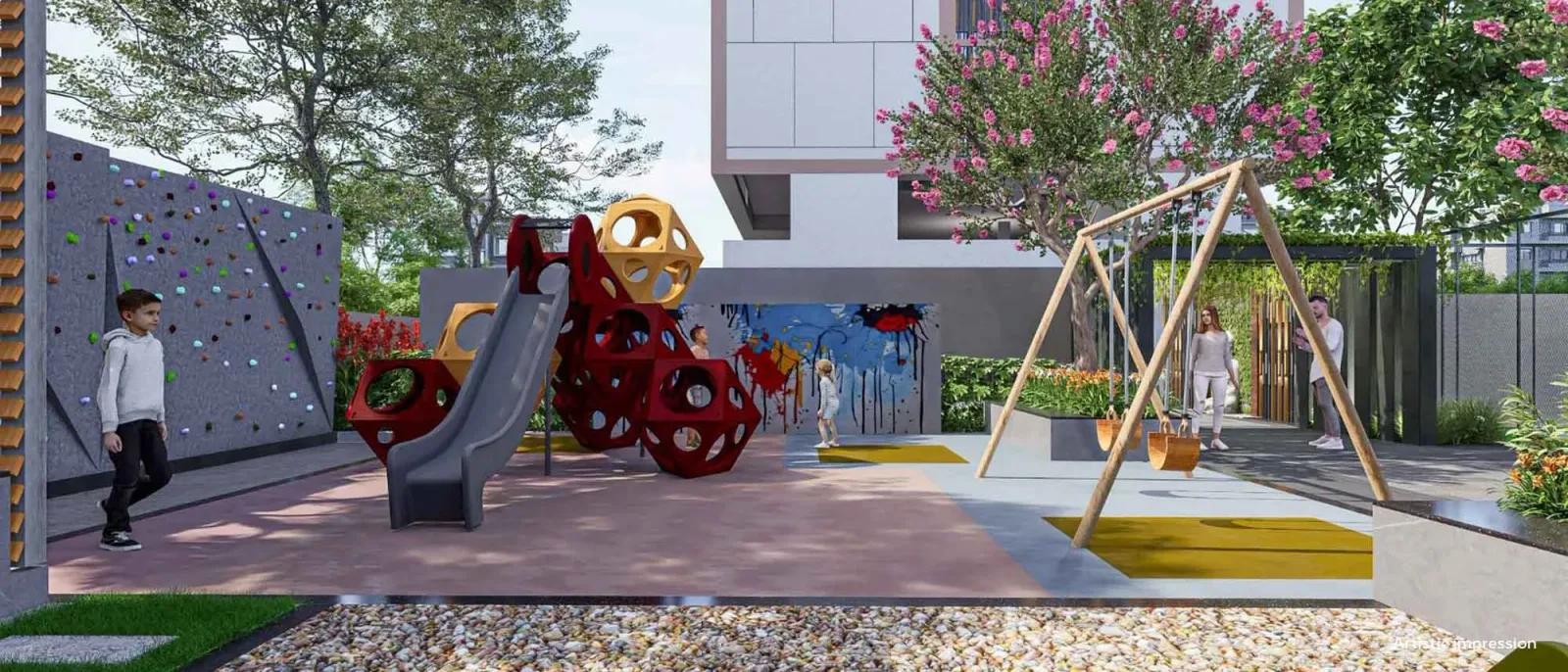 Children's play area with climbing wall at Navyam, Ravet