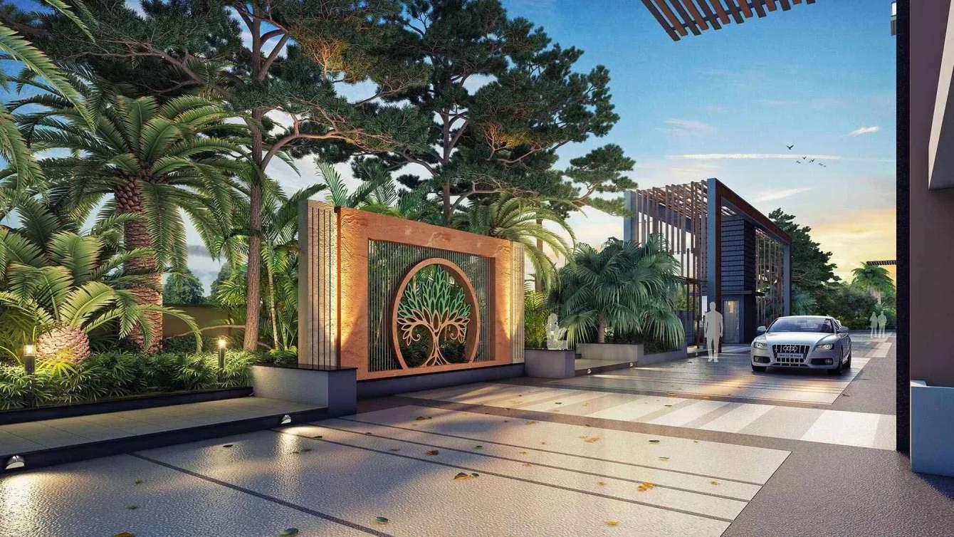 Entrance gate with a tree emblem wall and a car at Rachana Bella Casa Royale, Baner